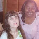 carmen and woman smiling at camera