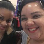 two women smiling at camera