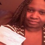 woman holding vaccination card