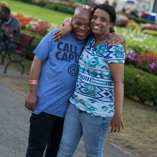 woman with arm around man