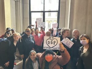 Group at Rally with Signs